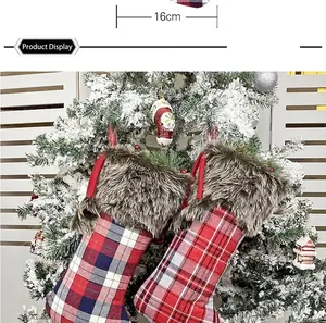 Detailed view of plaid Christmas stocking with 16cm width faux fur trim hanging on a tree