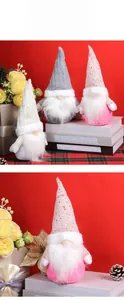 Detail of Christmas gnomes with sequined hats and white plush beards on festive background