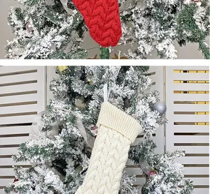 Detailed cable knit Christmas stocking with hanging loop in red and cream colors