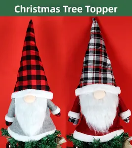 Close-up of Christmas gnome tree toppers with plaid hats and white faux fur beards