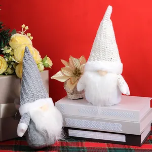 Nordic Christmas gnome plush dolls with knit hats on a festive red background