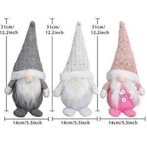 Three Nordic Christmas gnomes in grey white and pink plush with size 31x14cm details