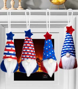Close-up of four July 4th gnome ornaments with American flag stars and stripes patterns