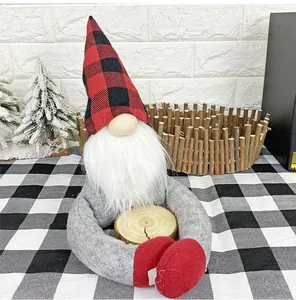 Close-up of a Christmas gnome decoration with red-black plaid hat and wooden accent