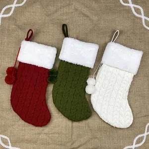 Three-piece knitted Christmas stockings in red, green, and white with plush faux fur cuffs