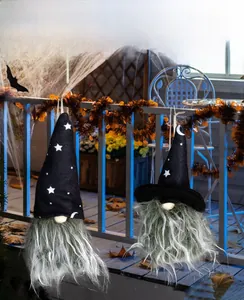 Detail showing hanging Halloween gnomes with star and moon patterns on pointed hats