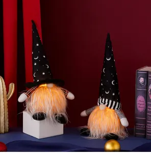 Close-up of glowing Halloween gnomes with LED warm light and star-patterned hats