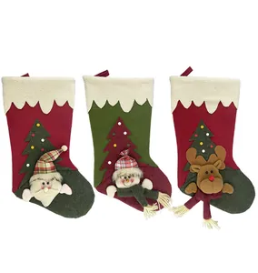 Three-piece Christmas stocking set featuring Santa, snowman, and reindeer 3D plush designs
