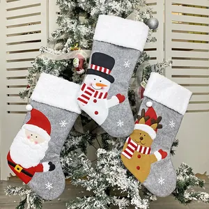 Three-piece set of gray felt Christmas stockings with 3D Santa, Snowman, and Reindeer applique