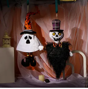 Detailed view of Halloween ghost and skull plush hanging ornaments with witch hats and boots