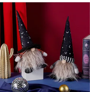 Detail of Halloween gnome figurines with star-printed wizard hats and glowing features