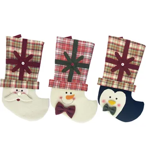 Detailed view of Christmas stockings set featuring Santa, Snowman, and Penguin designs