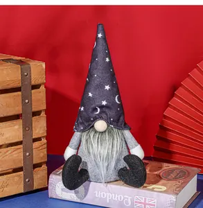 Detail of Halloween gnome decor featuring moon star hat and long fiber beard on wood box