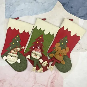 Three-piece Christmas stocking set featuring Santa, snowman, and reindeer 3D designs