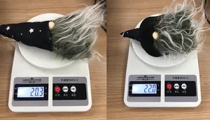 Weight measurement of Halloween gnome doll showing 20.3g and 22.0g on a digital scale