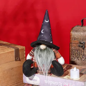 Gnome plush with black wizard hat and moon pattern on vintage books background