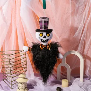 Hanging Halloween ghost skull prop with purple top hat and long black faux fur body