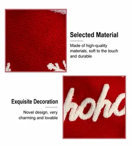 Detail of red Christmas stocking featuring white plush chenille embroidery and snowflake patterns