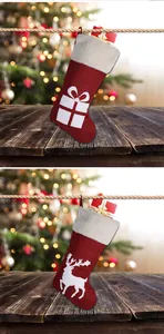 Detail of red burlap Christmas stockings with white faux fur trim and reindeer patterns