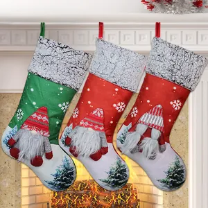 Close-up of three Christmas stockings with 3D gnomes hanging on a cozy fireplace mantle