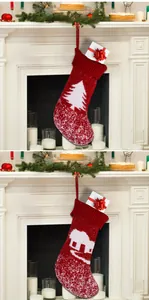Macro detail of red knitted Christmas stockings with snowflake patterns and small gold bells