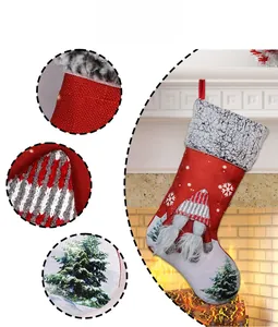 Detail view of red Christmas stocking with gnome 3D decor and white snowflake patterns