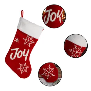 Classic red and white Christmas stocking with Joy embroidery and snowflake patterns
