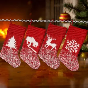 Set of 4 red knitted Christmas stockings with reindeer and snowflake patterns for tree decor