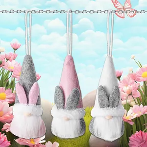 Three Easter gnome plush ornaments with rabbit ears hanging on a silver chain