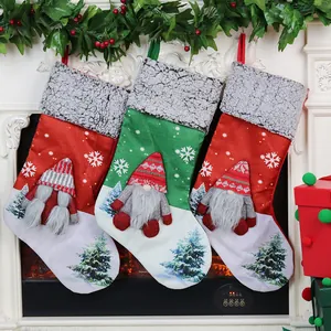 Three Christmas stockings featuring 3D faceless gnomes with white snowflakes and trees