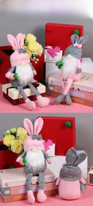 Detail of pink and grey Easter gnome plush dolls with bunny ears and long legs