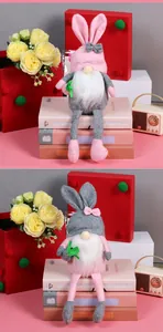 Detail of Easter gnome plush toys with bunny ears and long beards on a gift display