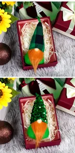 Detail of St. Patrick's Day gnomes with orange beards and green hats in a gift box