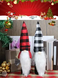 Close-up of gnome Christmas wine bottle covers with red and white plaid pointed hats