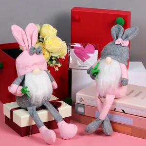 Easter gnome plush dolls with bunny ears and long white beards in festive gift setting