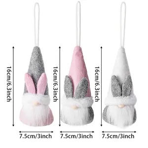 Three Easter gnome plush ornaments with rabbit ears and long white beards in pastel colors