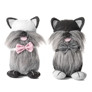 Lindos gnomos gatos de Pascua en peluche gris con lazos para decoración festiva