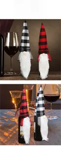 Close-up of gnome wine bottle covers with red and black checkered hats and faux fur beards