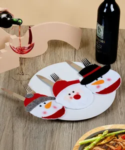 Tres fundas para cubiertos de Navidad con diseños de Papá Noel y muñeco de nieve