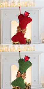 Detail of red and green dog bone knitted Christmas stockings with glittery bows