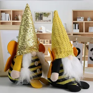 Pair of bumble bee gnomes with sequin and knit hats for creative home table decoration