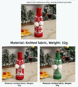 Detail of knitted snowman wine bottle cover made of 32g fabric with snowflake patterns