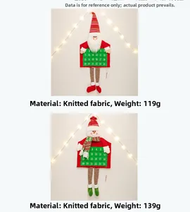Close-up of knitted Santa and Snowman advent calendar pockets for Christmas countdown