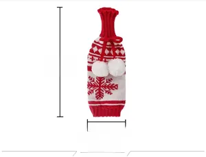 Detail of knitted snowman wine bottle cover with snowflakes and dimensions 30x10cm