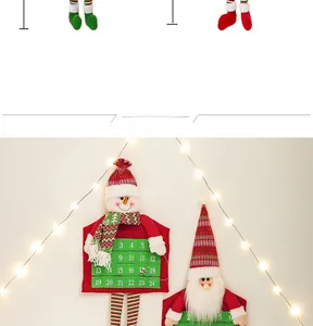 Detail of fabric Christmas advent calendar hanging with Santa and snowman pockets