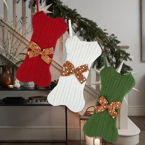 Knitted bone-shaped Christmas stockings in red and green for pet gift decoration