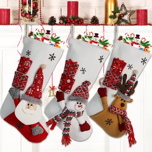 Three Christmas stockings with Santa, Snowman, and Reindeer 3D dolls for holiday decoration