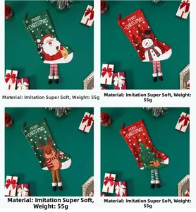 Detail of four faux super soft Christmas stockings featuring Santa, reindeer, and snowman