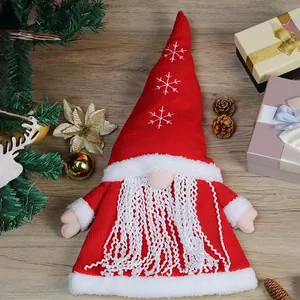 Christmas gnome tree topper with red knitted snowflake hat and white plush beard