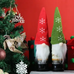 Christmas gnome wine bottle covers with red and green snowflake hats for holiday decor